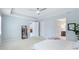 Tranquil main bedroom with tray ceilings, soft carpet, and ensuite bathroom access at 4325 Renwick Dr, Parrish, FL 34219