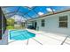 Screened-in pool area with sunny white deck, hose, and outdoor seating at 4325 Renwick Dr, Parrish, FL 34219