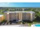 Aerial view of a multi-story condo building with well-maintained landscaping at 4460 Fairways Blvd #604 Blvd # 604, Bradenton, FL 34209
