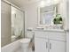 Bright bathroom featuring a shower-tub combo and a white vanity with a large mirror at 4460 Fairways Blvd #604 Blvd # 604, Bradenton, FL 34209