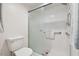 White bathroom with a glass shower and white tile at 4460 Fairways Blvd #604 Blvd # 604, Bradenton, FL 34209