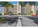 Beautiful exterior shot of multi-story condo building with manicured grounds and ample parking at 4460 Fairways Blvd #604 Blvd # 604, Bradenton, FL 34209