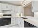 Kitchen featuring white cabinets, stainless steel sink, and stainless steel appliances at 4460 Fairways Blvd #604 Blvd # 604, Bradenton, FL 34209