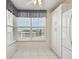 Dining area with floor to ceiling window view, next to the white kitchen at 4460 Fairways Blvd #604 Blvd # 604, Bradenton, FL 34209