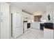 Spacious kitchen with white cabinets, tile floors, modern appliances and natural lighting at 4460 Fairways Blvd #604 Blvd # 604, Bradenton, FL 34209