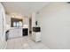 Open concept kitchen with white cabinets, tile floors, and modern appliances at 4460 Fairways Blvd #604 Blvd # 604, Bradenton, FL 34209