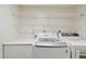 Laundry room with LG washer and dryer, countertop, and wire shelving at 4460 Fairways Blvd #604 Blvd # 604, Bradenton, FL 34209