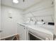 Clean laundry room with newer LG washer and dryer and wire shelving at 4460 Fairways Blvd #604 Blvd # 604, Bradenton, FL 34209