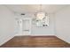 Open-concept living area with wood floors and view into the kitchen at 4460 Fairways Blvd #604 Blvd # 604, Bradenton, FL 34209