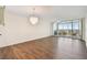 Bright living room with wood floors, chandelier, and sliding glass doors to balcony at 4460 Fairways Blvd #604 Blvd # 604, Bradenton, FL 34209