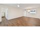 Spacious living room with wood floors and access to additional rooms at 4460 Fairways Blvd #604 Blvd # 604, Bradenton, FL 34209