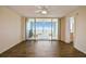 Bright living room with wood floors, ceiling fan, and balcony with seating at 4460 Fairways Blvd #604 Blvd # 604, Bradenton, FL 34209