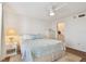 Bedroom featuring wood floors, ceiling fan, and ensuite bathroom at 4460 Fairways Blvd #604 Blvd # 604, Bradenton, FL 34209