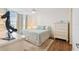 Bright bedroom with a ceiling fan, wood floors and coastal-themed decor at 4460 Fairways Blvd #604 Blvd # 604, Bradenton, FL 34209