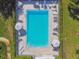 Bird's eye view of a rectangular pool bordered by lounge chairs and umbrellas, set in a lawn area at 4460 Fairways Blvd #604 Blvd # 604, Bradenton, FL 34209