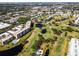 Panoramic aerial view of a golf course community with ponds and lush greenery at 4570 Pinebrook Cir # 406, Bradenton, FL 34209