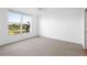 Bedroom featuring a window view of lake and golf course at 4570 Pinebrook Cir # 406, Bradenton, FL 34209