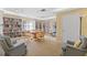 Inviting library area with bookshelves, table, and seating for reading and relaxation at 4570 Pinebrook Cir # 406, Bradenton, FL 34209