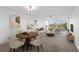 Bright living room and dining area featuring large windows with a golf course view at 4570 Pinebrook Cir # 406, Bradenton, FL 34209