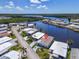 Aerial view of a waterfront property, showcasing its prime location with stunning water views and easy access to amenities at 520 Ideal Pl, North Port, FL 34287