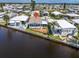 Aerial view of waterfront home featuring a new deck and easy access to the water at 520 Ideal Pl, North Port, FL 34287