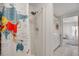Bathroom featuring a shower with a world map shower curtain, modern sink, and white cabinets at 520 Ideal Pl, North Port, FL 34287
