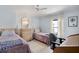 Inviting bedroom with two twin beds, neutral tones, and a comfortable desk area at 520 Ideal Pl, North Port, FL 34287