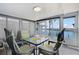 Enclosed Florida room with multiple windows and comfortable seating offering waterfront views at 520 Ideal Pl, North Port, FL 34287