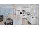 Modern kitchen with white cabinets, sleek countertops, and stainless steel appliances, offering a clean design at 520 Ideal Pl, North Port, FL 34287