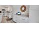 Modern kitchen features white cabinetry and marble counters offering both style and functionality at 520 Ideal Pl, North Port, FL 34287