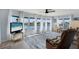 Bright living room with water views, large windows, and comfortable seating creating a relaxing atmosphere at 520 Ideal Pl, North Port, FL 34287