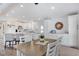 Open living space with modern kitchen, dining area, and seating, perfect for entertaining at 520 Ideal Pl, North Port, FL 34287