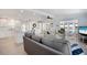Spacious living space with a modern kitchen, comfortable seating, and abundant natural light creating a cozy atmosphere at 520 Ideal Pl, North Port, FL 34287