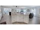 Spacious open living area with kitchen island and seating area, perfect for entertaining at 520 Ideal Pl, North Port, FL 34287