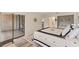 Bright bedroom featuring a star themed comforter, wood floors, and access to a private patio at 5264 Lake Village Dr # 48, Sarasota, FL 34235