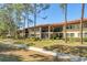 Charming condo community with lush landscaping, inviting balconies, and well-maintained walkways at 5264 Lake Village Dr # 48, Sarasota, FL 34235
