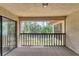 Enclosed patio with natural light and a great outdoor view of the community and landscaping at 5264 Lake Village Dr # 48, Sarasota, FL 34235