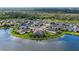 Aerial view of lakeside homes, showing the community layout and waterfront access at 5811 Campina Pl, Palmetto, FL 34221