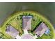 Aerial view showcasing the home's location on the lake with pool and patio at 5811 Campina Pl, Palmetto, FL 34221