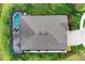 Aerial view of the property, showing the pool, patio, and manicured lawn at 5811 Campina Pl, Palmetto, FL 34221