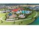 Aerial view showcasing the community pool, splashpad and playground in the Trevesta community at 5811 Campina Pl, Palmetto, FL 34221