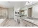 Bright bathroom featuring double sinks, granite countertops, and a separate shower and tub at 5811 Campina Pl, Palmetto, FL 34221