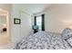 Cozy bedroom featuring a plush bed, closet, and a window offering natural light at 5811 Campina Pl, Palmetto, FL 34221