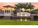 Beautiful Trevesta community entrance with stone accents and a charming water feature at 5811 Campina Pl, Palmetto, FL 34221