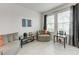 Bright den with neutral decor, featuring comfortable seating, tile flooring, and lots of natural light at 5811 Campina Pl, Palmetto, FL 34221
