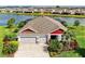Beautiful home with a three car garage and a lake view at 5811 Campina Pl, Palmetto, FL 34221