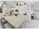 Bright, white kitchen with stone countertops and stainless steel appliances at 5811 Campina Pl, Palmetto, FL 34221