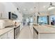 Bright, white kitchen with stone countertops and stainless steel appliances at 5811 Campina Pl, Palmetto, FL 34221