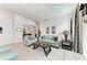 Bright living room featuring neutral walls, tile floors, and comfortable seating arrangement at 5811 Campina Pl, Palmetto, FL 34221