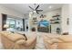 Bright living room with tile floors, comfortable seating, and sliding glass doors to outdoor patio at 5811 Campina Pl, Palmetto, FL 34221